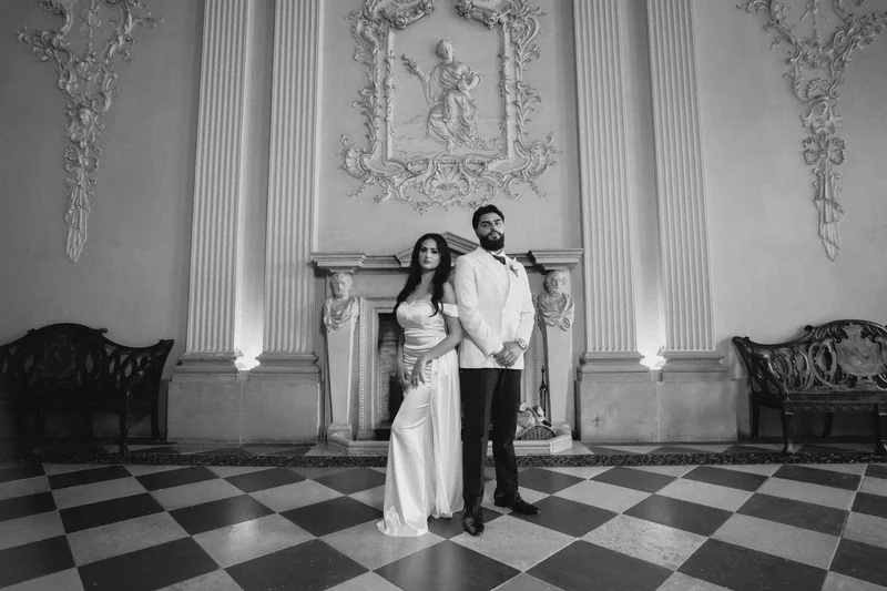 Black and white portrait of the couple in the grand room