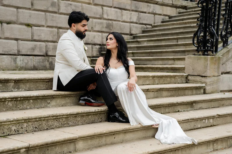 Jessica and Ajay sharing a quiet moment on the steps