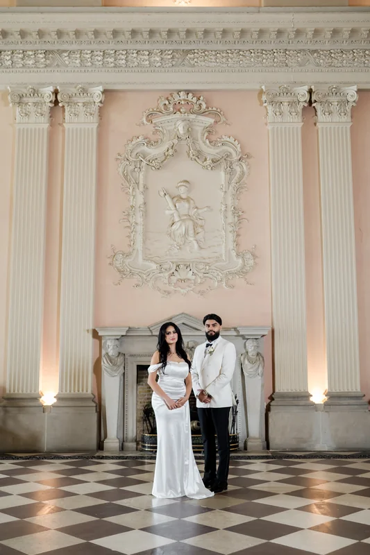 A wide portrait beneath the chandelier