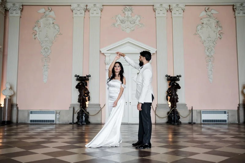Jessica and Ajay together on the patterned floor