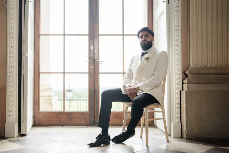 Ajay seated beside the window