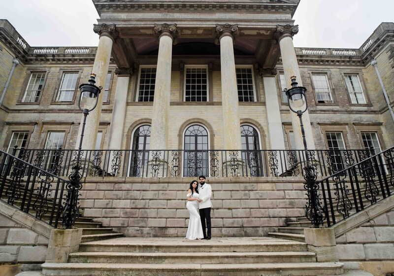Wedding couple on the steps of a grand building